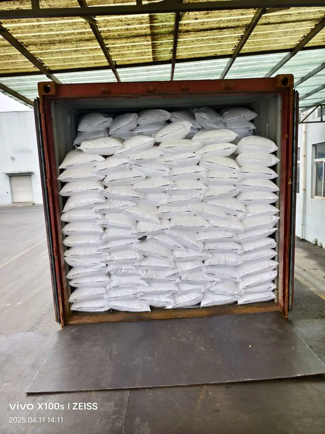 Container loaded with 25 kg bags at origin factory