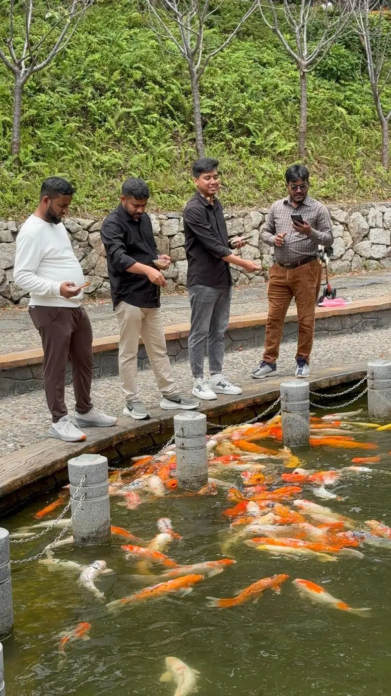 Team observing fish at an aquaculture site in China