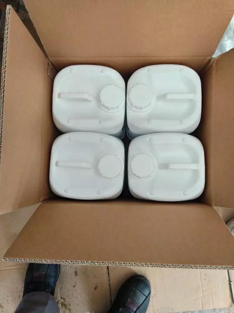 White jerry cans packed in a shipping carton